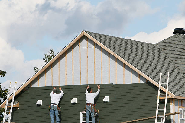 Professional Siding Installation technician working in Uhrichsville, OH